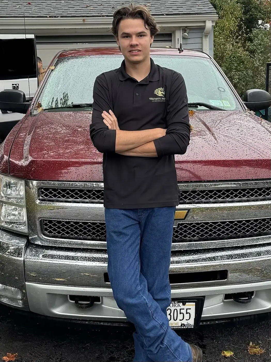 Timothy standing in front of the Trinity Point truck